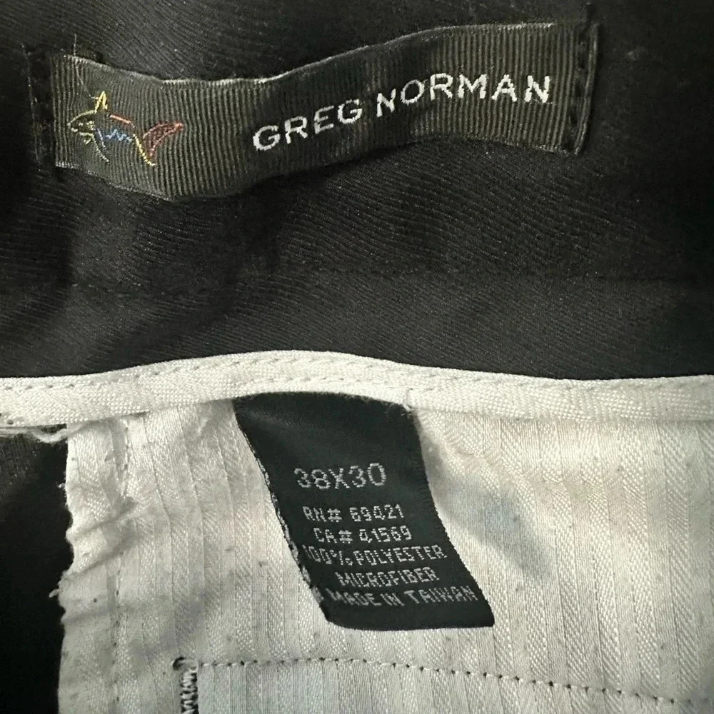 Greg Norman black, pleated golf slacks with a cuff.  Size 38x30